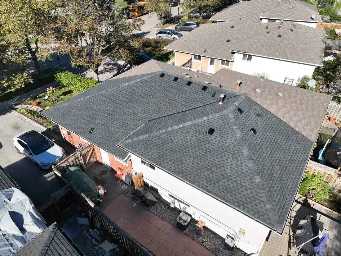 Finished roof replacement on a Mississauga detached house on Bonnymede Drive, seen from above with neighbouring homes behind