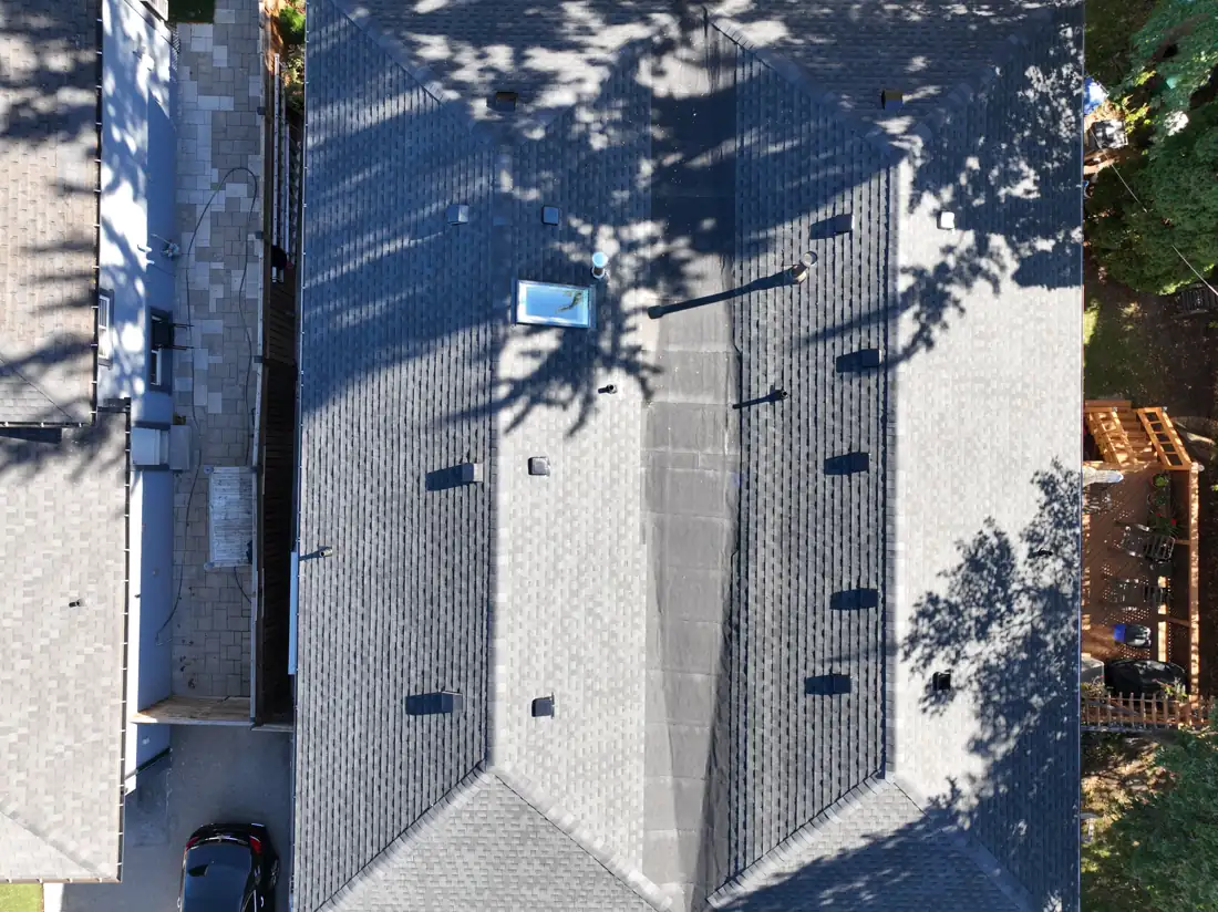 Overhead drone view of the finished Bonnymede Drive roof with new roof vents and a skylight
